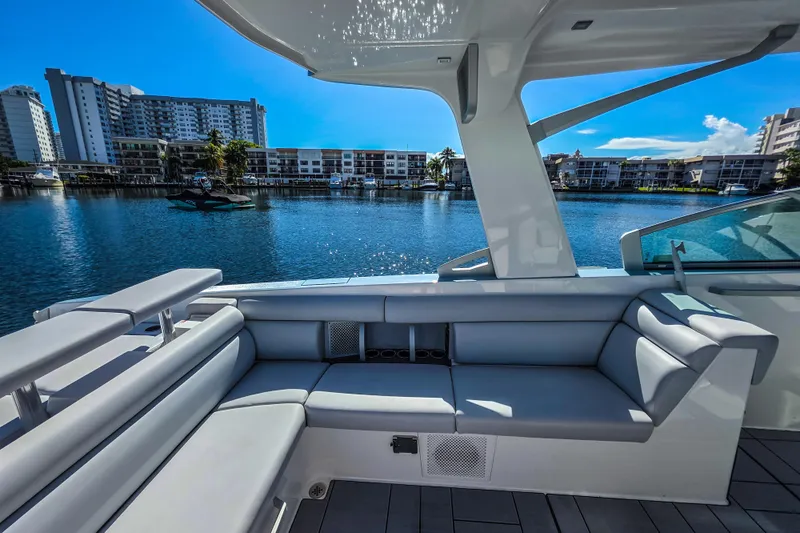  Yacht Photos Pics 2022 Aviara AV32 OB boat interior with waterfront cityscape view.