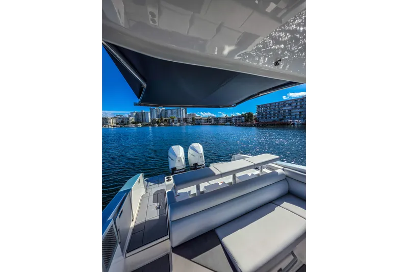  Yacht Photos Pics 2022 Aviara AV32 OB boat with spacious seating, overlooking a scenic waterfront view.