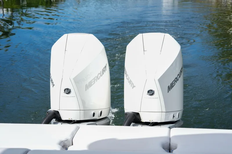  Yacht Photos Pics Twin Mercury outboard engines on a 2022 Aviara AV32 OB boat in water.