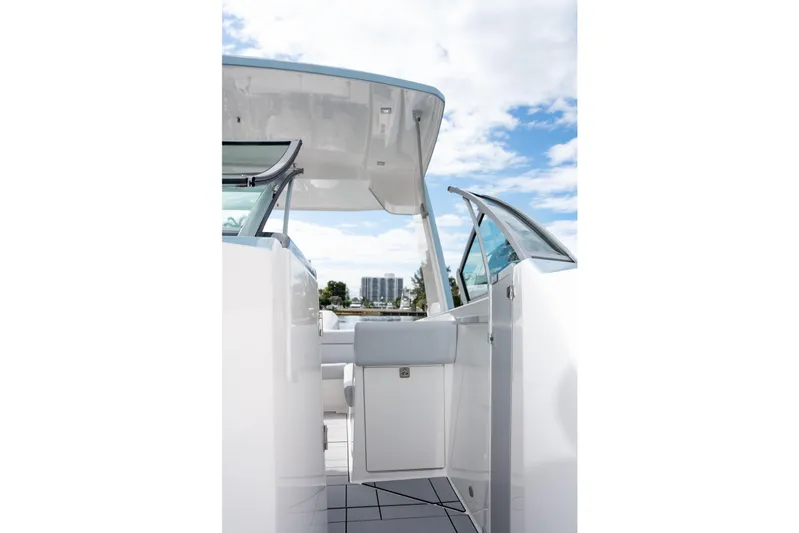  Yacht Photos Pics 2022 Aviara AV32 OB boat interior with open door, showcasing sleek design and clear sky.