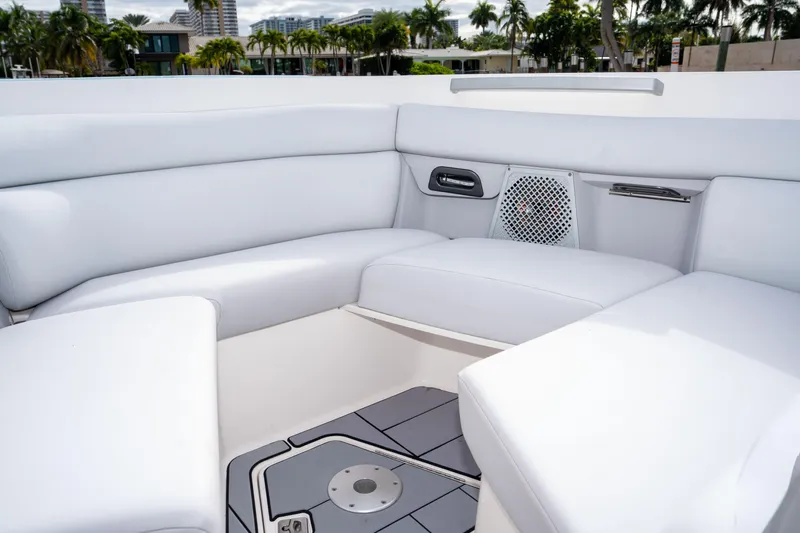  Yacht Photos Pics 2022 Aviara AV32 OB boat interior with white seating and speaker system.