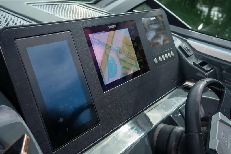  Yacht Photos Pics Dashboard of 2022 Aviara AV32 OB boat with navigation screens and controls.