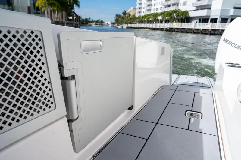  Yacht Photos Pics 2022 Aviara AV32 OB boat deck with open hatch, dockside view.