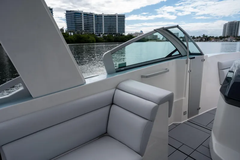  Yacht Photos Pics 2022 Aviara AV32 OB boat interior with modern seating and waterfront view.