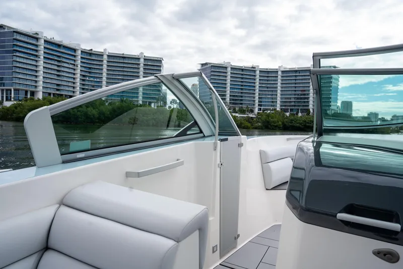  Yacht Photos Pics 2022 Aviara AV32 OB boat interior with modern design, cityscape in background.
