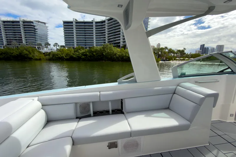  Yacht Photos Pics Luxurious seating on 2022 Aviara AV32 OB boat with scenic waterfront view.