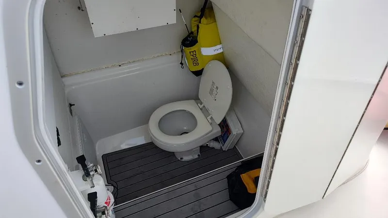  Yacht Photos Pics 2023 Cape Horn 27 XS boat interior with toilet and safety equipment.