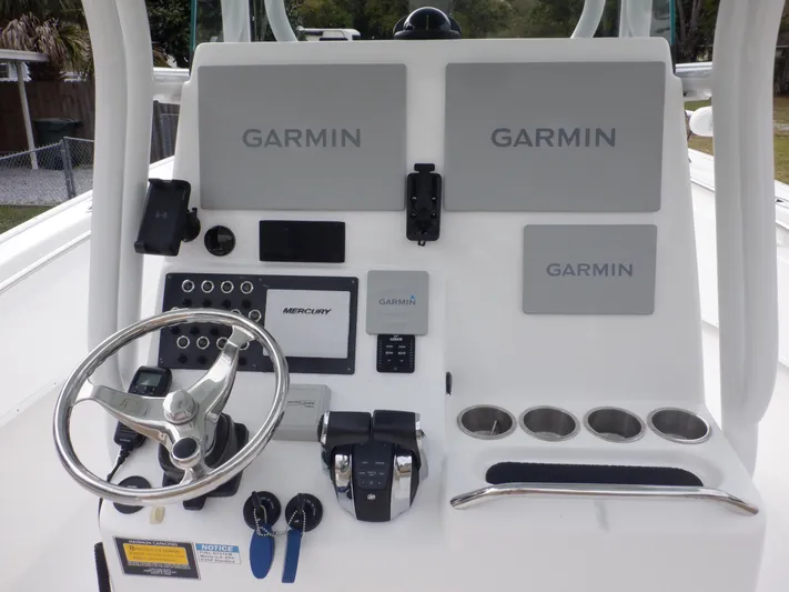  Yacht Photos Pics 2023 Cape Horn 27 XS boat dashboard with Garmin navigation displays and controls.
