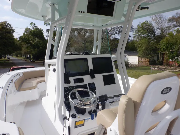  Yacht Photos Pics 2023 Cape Horn 27 XS boat cockpit with modern controls and seating.
