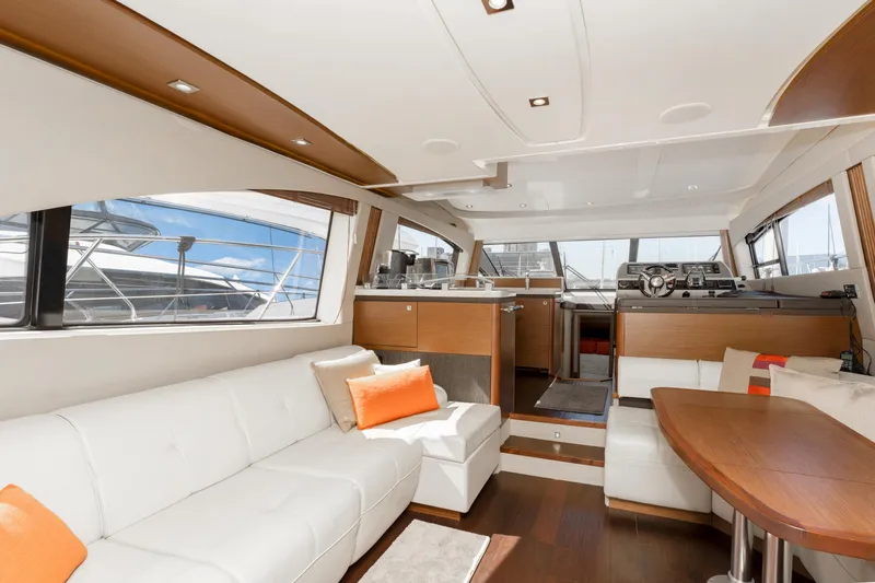 Waterfront III Yacht Photos Pics Luxurious interior of 2014 Sea Ray 510 Fly yacht with modern furnishings and panoramic windows.