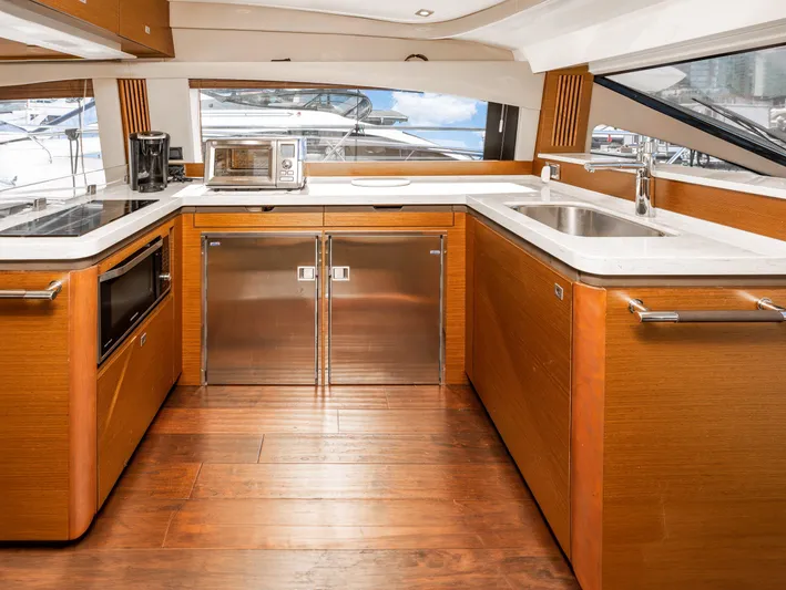 Waterfront III Yacht Photos Pics Luxurious kitchen interior of 2014 Sea Ray 510 Fly yacht with modern appliances.