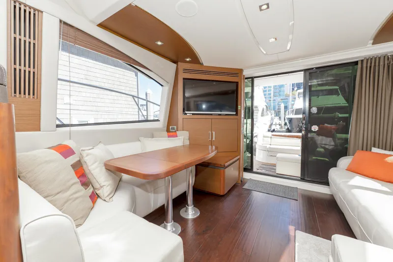 Waterfront III Yacht Photos Pics Luxurious interior of 2014 Sea Ray 510 Fly yacht with modern furnishings and large windows.