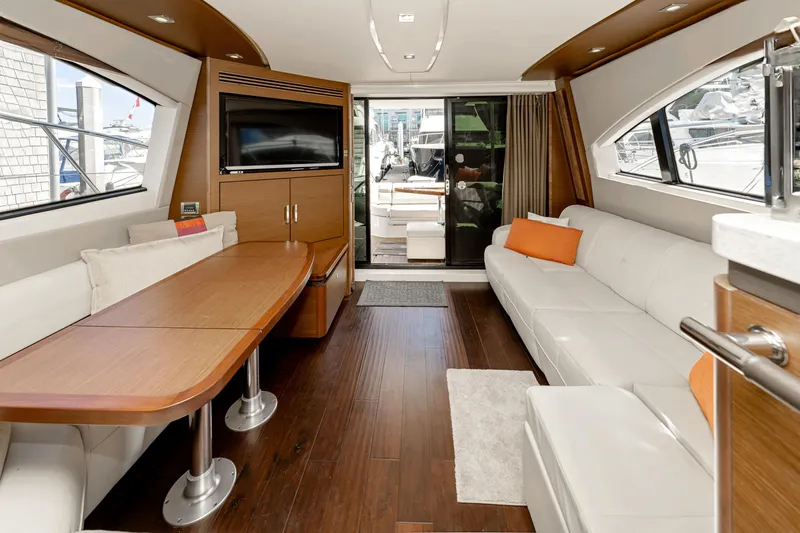 Waterfront III Yacht Photos Pics Luxurious interior of 2014 Sea Ray 510 Fly yacht with modern furnishings and wood accents.