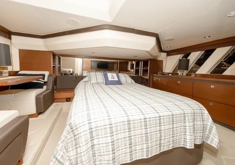 Waterfront III Yacht Photos Pics Luxurious bedroom interior of 2014 Sea Ray 510 Fly yacht with modern furnishings.