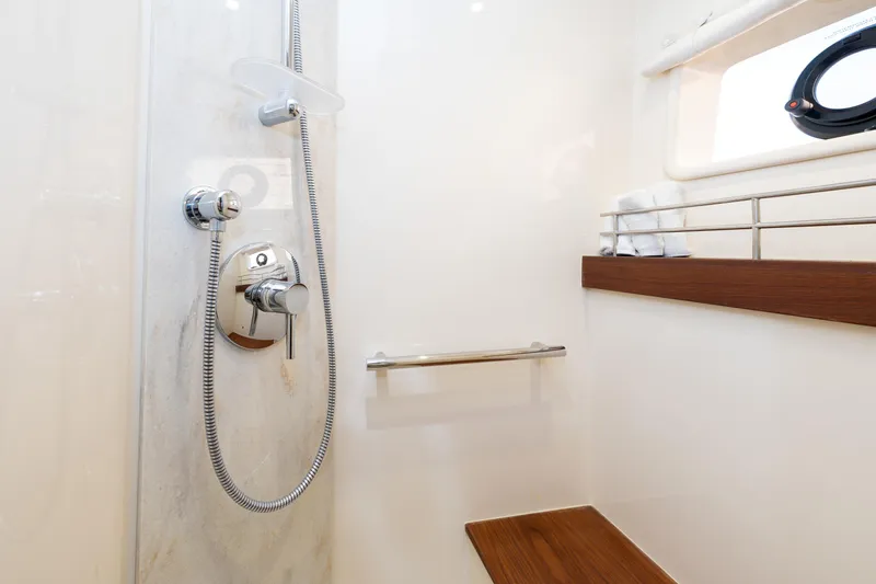 Waterfront III Yacht Photos Pics Shower area in 2014 Sea Ray 510 Fly yacht with modern fixtures and wooden accents.