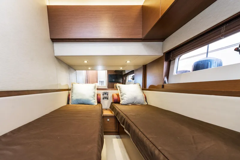 Waterfront III Yacht Photos Pics Interior cabin of 2014 Sea Ray 510 Fly yacht with twin beds and modern decor.