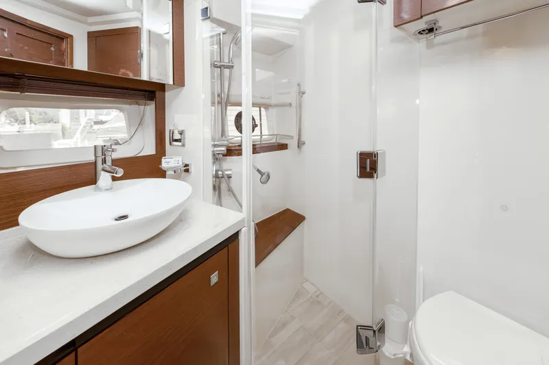 Waterfront III Yacht Photos Pics Luxurious bathroom interior of 2014 Sea Ray 510 Fly yacht with modern fixtures.