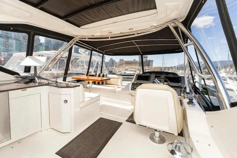 Waterfront III Yacht Photos Pics Luxurious interior of 2014 Sea Ray 510 Fly yacht with modern seating and panoramic windows.