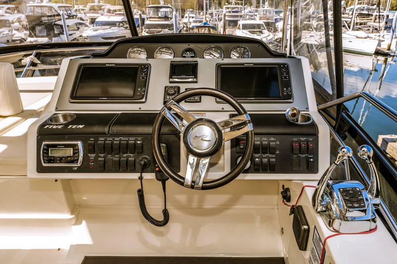 Waterfront III Yacht Photos Pics 2014 Sea Ray 510 Flybridge helm with dual displays and modern controls.