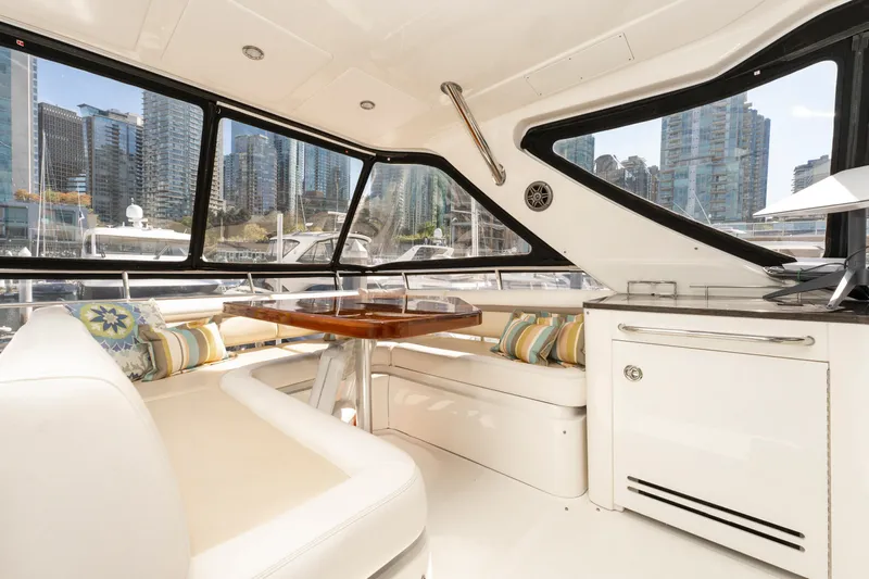 Waterfront III Yacht Photos Pics Luxurious interior of 2014 Sea Ray 510 Fly yacht with cityscape view.