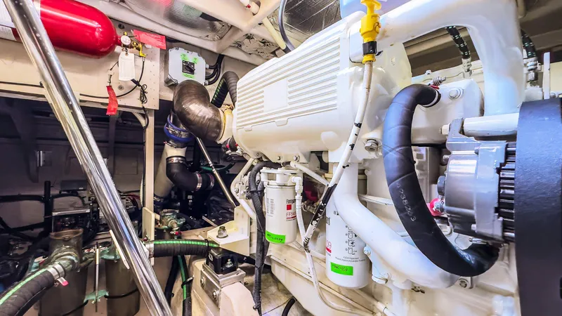 Waterfront III Yacht Photos Pics Engine room of 2014 Sea Ray 510 Fly yacht, showcasing mechanical components and systems.