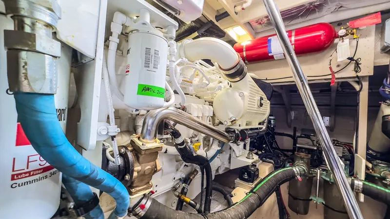 Waterfront III Yacht Photos Pics Engine room of 2014 Sea Ray 510 Fly yacht, showcasing mechanical components and systems.