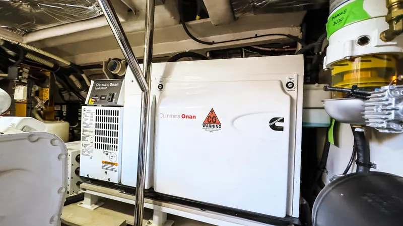 Waterfront III Yacht Photos Pics Engine room of 2014 Sea Ray 510 Fly with Cummins Onan generator.