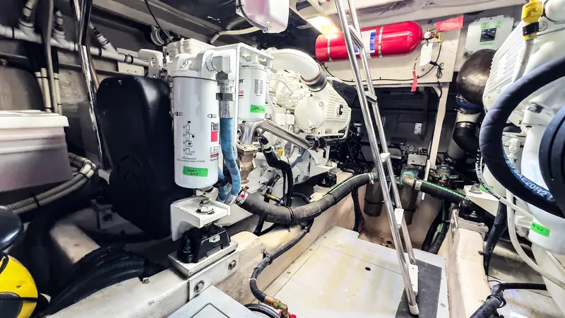 Waterfront III Yacht Photos Pics Engine room of 2014 Sea Ray 510 Fly yacht, showcasing mechanical components and equipment.