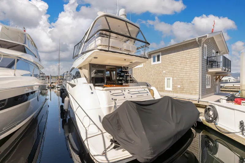 Waterfront III Yacht Photos Pics 2014 Sea Ray 510 Fly yacht docked at marina under blue sky.