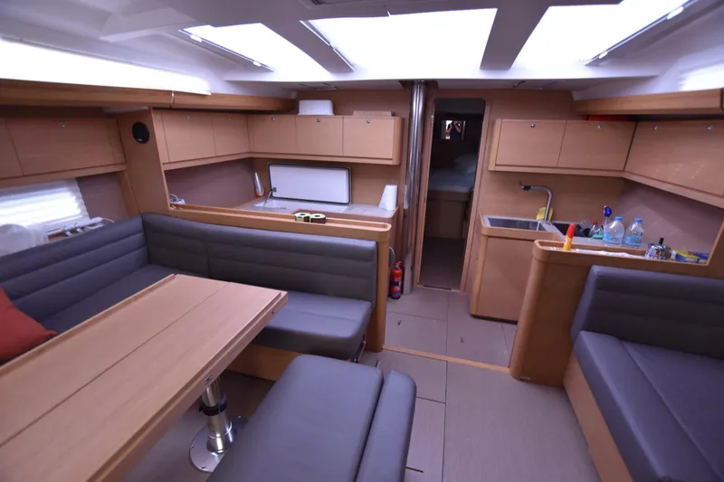 Gypsy Yacht Photos Pics Spacious interior of 2015 Dufour 500 Grand Large yacht with modern kitchen and seating area.