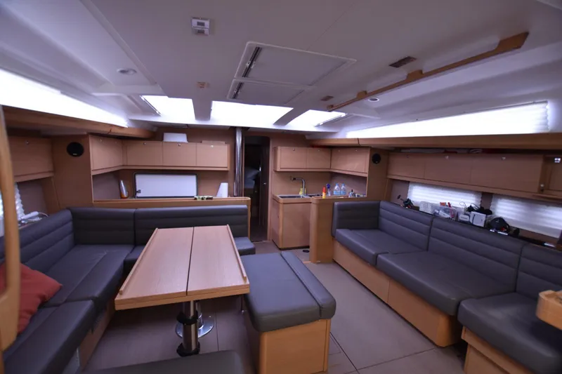 Gypsy Yacht Photos Pics Spacious interior of 2015 Dufour 500 Grand Large yacht with modern seating and dining area.