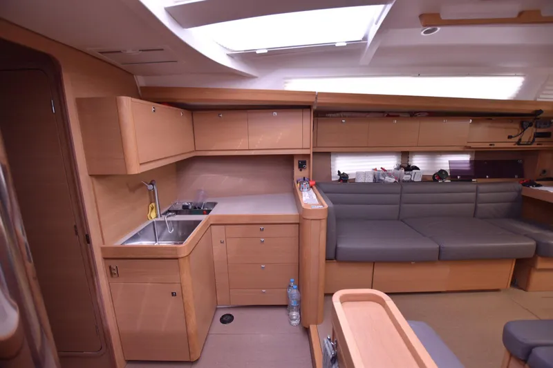 Gypsy Yacht Photos Pics Interior of 2015 Dufour 500 Grand Large yacht, featuring modern kitchen and seating area.