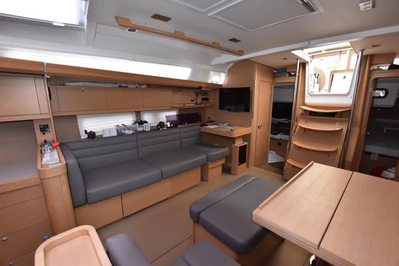 Gypsy Yacht Photos Pics Interior of 2015 Dufour 500 Grand Large yacht with modern seating and wooden finishes.