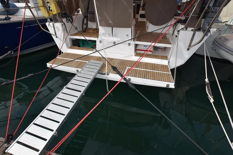 Gypsy Yacht Photos Pics Stern view of 2015 Dufour 500 Grand Large sailing yacht with gangway and rigging.