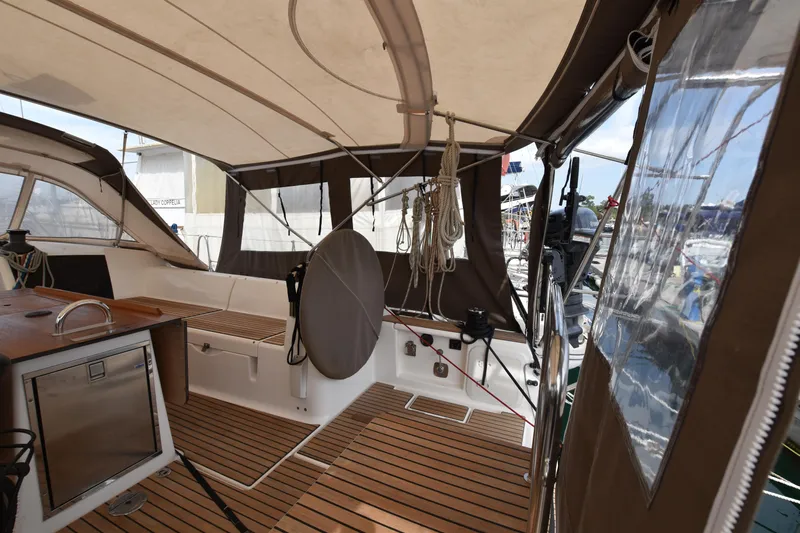 Gypsy Yacht Photos Pics Interior view of 2015 Dufour 500 Grand Large sailing yacht with wooden deck and covered cockpit.