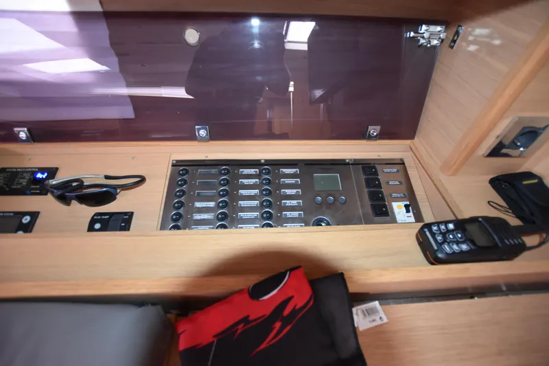 Gypsy Yacht Photos Pics Control panel inside 2015 Dufour 500 Grand Large yacht, featuring navigation and communication equipment.