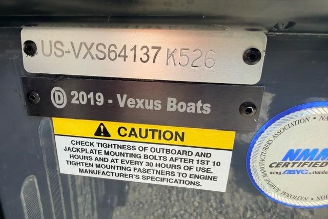 2026 Vexus VXs20 boat identification plate with caution label and certification sticker.