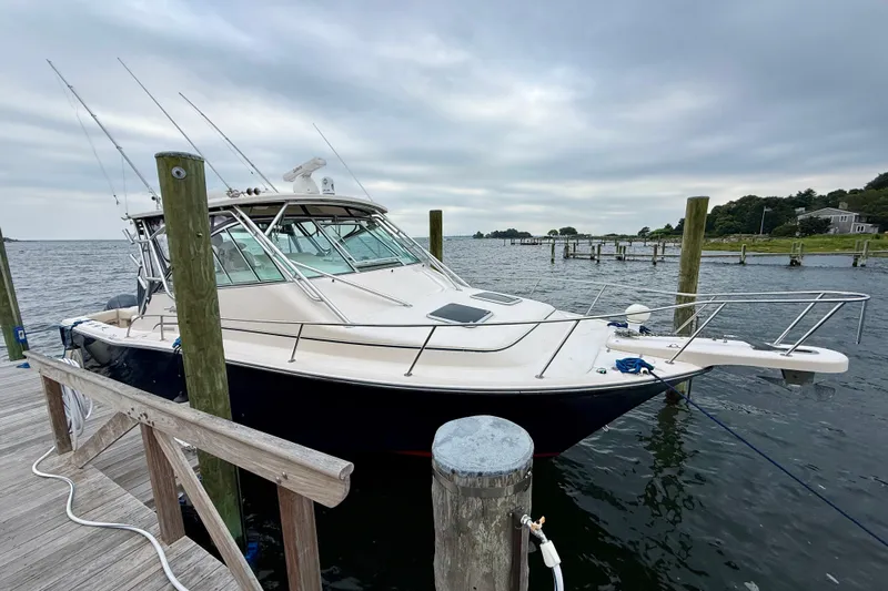  Yacht Photos Pics 2008 Grady-White Express 360 boat docked at a marina under cloudy skies.