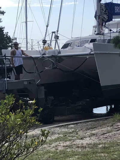 Adventure Yacht Photos Pics 2010 Broadblue 435 catamaran being transported on a trailer near a waterfront.