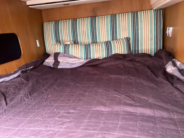 Adventure Yacht Photos Pics Cozy cabin bed with striped headboard in 2010 Broadblue 435 catamaran.