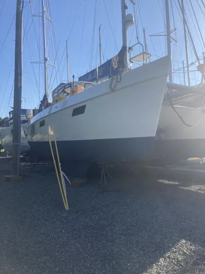 Adventure Yacht Photos Pics Broadblue 435 catamaran from 2010 on dry dock, surrounded by other boats.