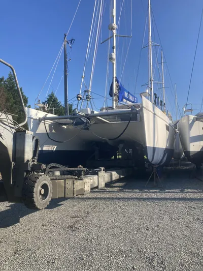 Adventure Yacht Photos Pics Broadblue 435 catamaran from 2010 on dry dock, surrounded by other boats.
