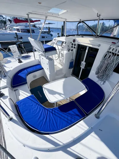 Adventure Yacht Photos Pics 2010 Broadblue 435 yacht cockpit with blue seating, steering wheel, and navigation equipment.