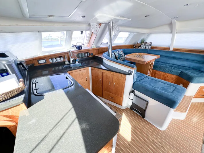 Adventure Yacht Photos Pics Spacious interior of 2010 Broadblue 435 catamaran with modern kitchen and seating area.
