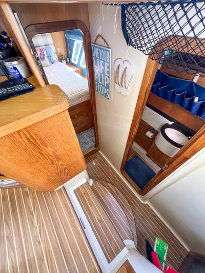 Adventure Yacht Photos Pics Interior of a 2010 Broadblue 435 catamaran with wood accents and nautical decor.