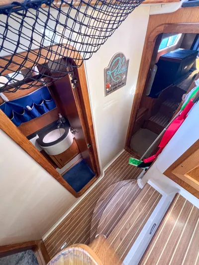 Adventure Yacht Photos Pics Interior of 2010 Broadblue 435 catamaran, featuring bathroom and wooden flooring.