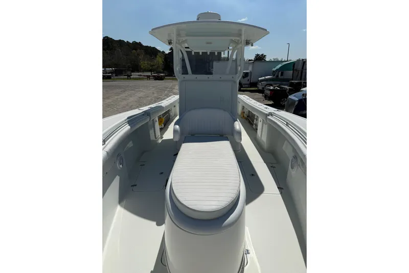 Cut Loose Yacht Photos Pics 2013 Yellowfin 32 Offshore boat interior with seating and console, parked outdoors.