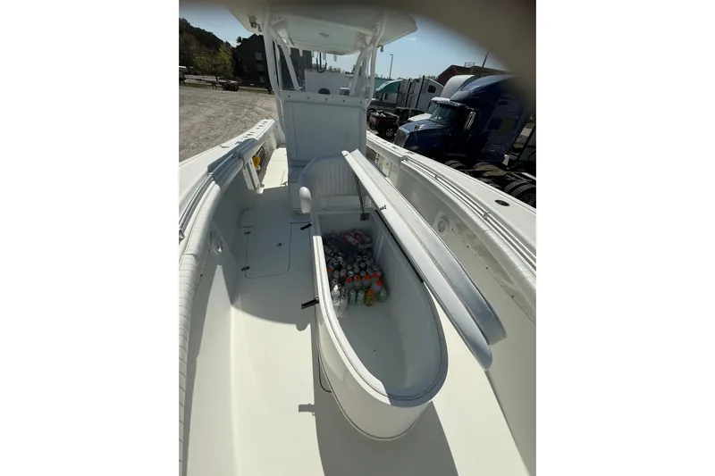 Cut Loose Yacht Photos Pics 2013 Yellowfin 32 Offshore boat interior with open storage compartment filled with drinks.