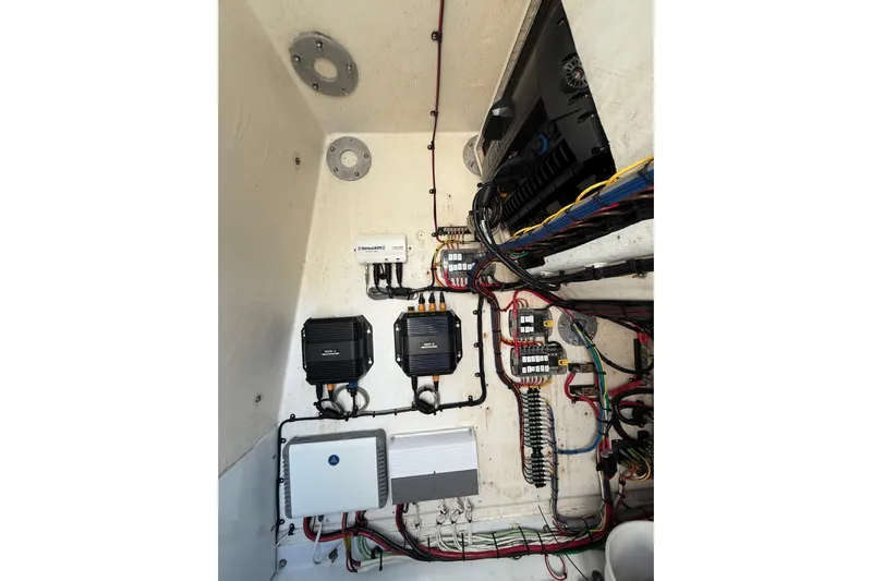 Cut Loose Yacht Photos Pics Electrical system inside a 2013 Yellowfin 32 Offshore boat, showcasing wiring and components.