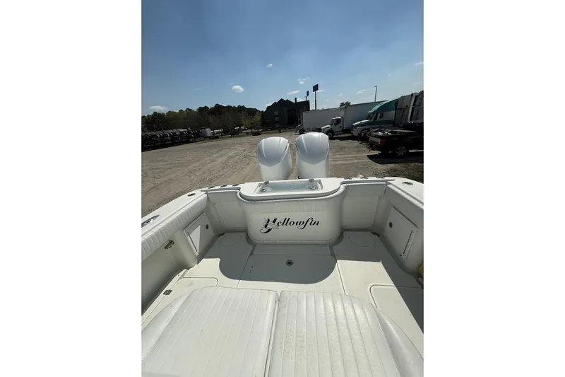 Cut Loose Yacht Photos Pics 2013 Yellowfin 32 Offshore boat interior with dual engines, parked outdoors.